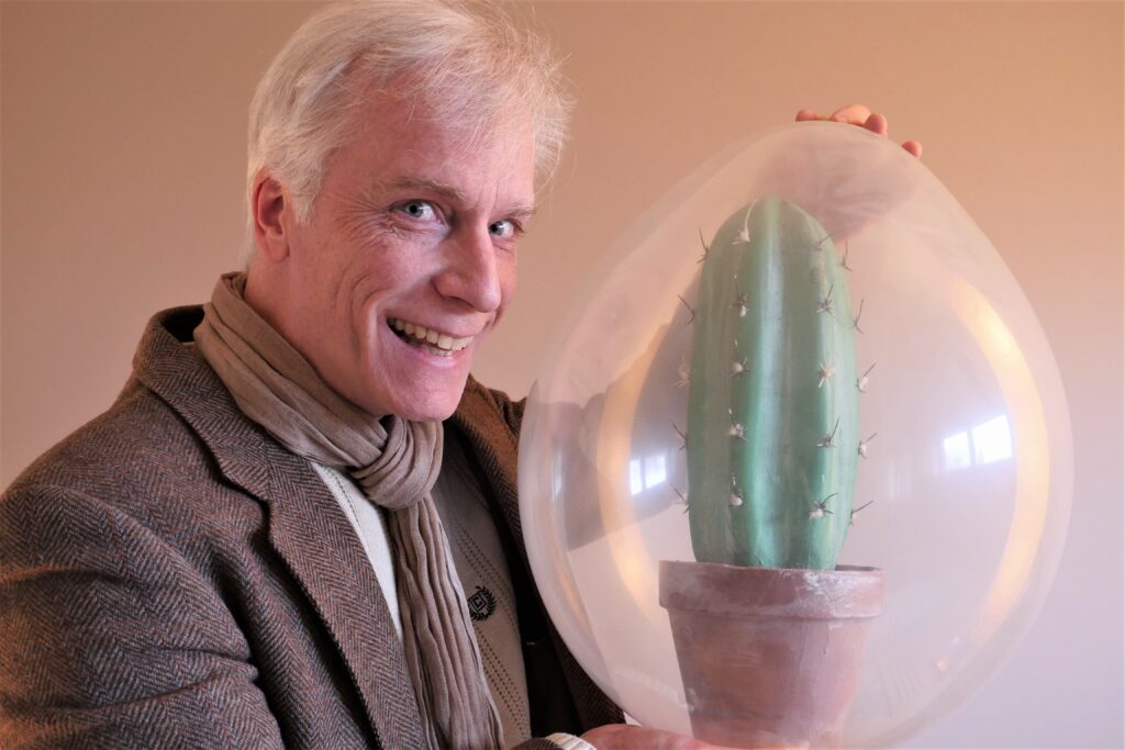 Ottawa Magician, Chris Pilsworth, has a cactus inside a balloon.